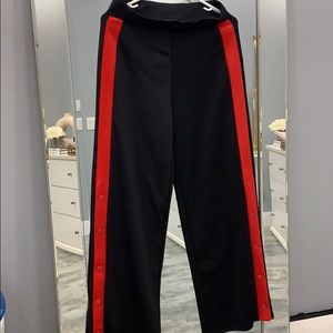 Black pant with red sides and buttons